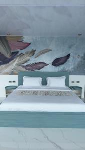 Ένα ή περισσότερα κρεβάτια σε δωμάτιο στο Pachamama Ecolodge Baños de Agua Santa - Ecuador