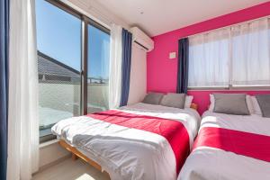 Postel nebo postele na pokoji v ubytování Detached house in Oshima 4chome, one train ride to Shinjuku 大島4丁目