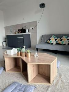 a living room with a coffee table and a couch at Netflix - City View Pano Studio with Skypool, Free parking and 5 mins to MRT in Kuala Lumpur