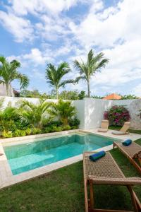 a swimming pool in the yard of a villa at 2Bedrooms Bright&Modern Villa near Balangan Beach! in Jimbaran