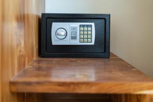 a small television sitting on a wooden table at 2Bedrooms Bright&Modern Villa near Balangan Beach! in Jimbaran