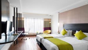 Postel nebo postele na pokoji v ubytování HYCINTH Hotels
