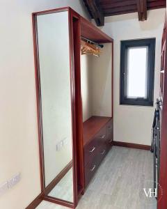 a walk in closet with a glass door at The Triplex at Villa Horizon - Three Private Suites in Rodney Bay Village