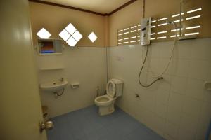 a bathroom with a toilet and a sink at Namtok Bungalows in Ko Yao Noi +52 photos