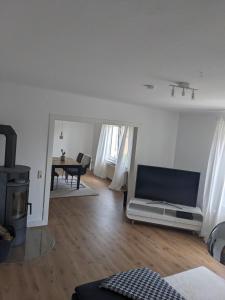 a living room with a couch and a table at Fewo Steckinghof in Coesfeld +9 photos