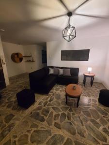 a living room with a couch and a table at Casa Manila Medellin in Medellín