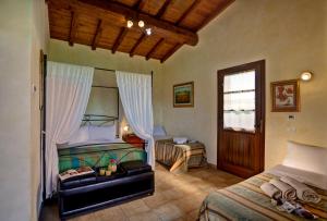 Posteľ alebo postele v izbe v ubytovaní Villa Hotel Valle Del Marta Resort