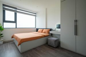 Ένα ή περισσότερα κρεβάτια σε δωμάτιο στο Tobe in Hue 2 - Cozy, modern apartment 2 Beds have gym, pool free +33 φωτογραφίες