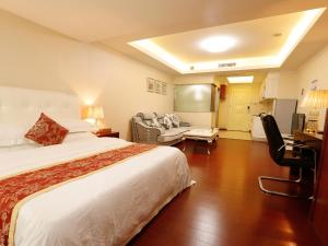 Letto o letti in una camera di Guangzhou Pengman Apartment Zhengjia Huanshi Branch