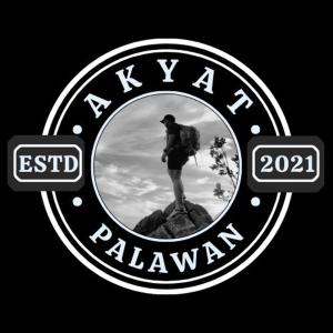 a picture of a man standing on top of a mountain at AkyatPalawan in Puerto Princesa City