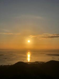 a sun setting over a body of water at AkyatPalawan in Puerto Princesa City
