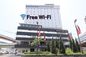 a building with the free wifi sign on it at Kobe Port Tower Hotel in Kobe