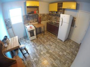 an overhead view of a kitchen with a refrigerator at Social Hostel Café e Bar in Curitiba