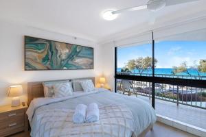 Ένα ή περισσότερα κρεβάτια σε δωμάτιο στο The Ocean Arcade - Views Games & Vibes +24 φωτογραφίες