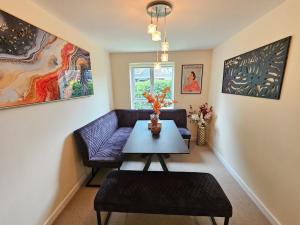 a living room with a couch and a table at Durham city free onsite parking in Sheepscar