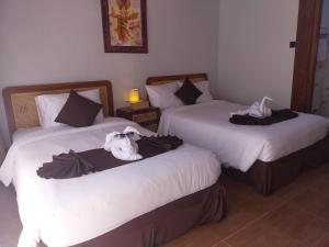 En eller flere senge i et værelse på Air ilir Grand Villa