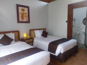 En eller flere senge i et værelse på Air ilir Grand Villa