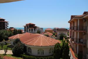 a view of a building with a red roof at Karchevi Apartment in Sveti Vlas