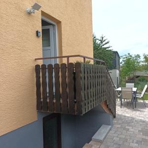 a wooden balcony on the side of a building at Panoramablick in Litzendorf in Litzendorf