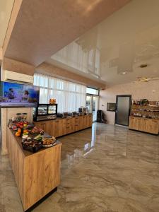 a large room with a buffetasteryasteryasteryasteryasteryasteryasteryasteryasteryastery at Alemar Mamaia Nord in Năvodari