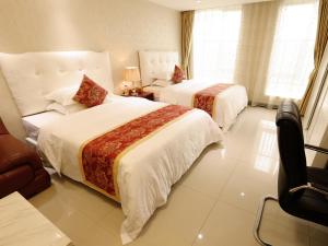 Cama o camas de una habitación en Guangzhou Boman Apartment Zhengjia Huanshi Branch