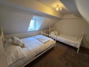 Ένα ή περισσότερα κρεβάτια σε δωμάτιο στο The Broadstairs Loft