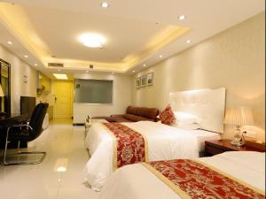 Cama o camas de una habitación en Guangzhou Boman Apartment Zhengjia Huanshi Branch