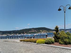 a view of a harbor with boats in the water at O Recuncho de Mugardos in Mugardos