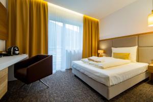 Postel nebo postele na pokoji v ubytování Village Resort Hanuliak