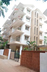 a view of the front of a building at Ivy Retreat- Serviced Apartments in Baga