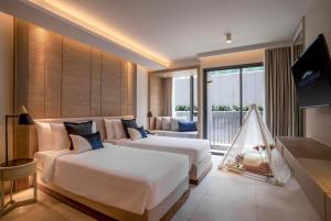 Howard Johnson by Wyndham Pattaya JC客房内的一张或多张床位