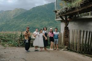 a group of people standing in front of a fence at Lagom Home - Bamboo Forest in Sapa +234 photos