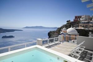 a view of the ocean from the balcony of a house at Lava On the Cliff in Fira