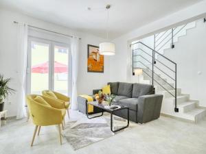 a living room with a couch and a table at Villa Gaby with Heated Pool in Božava