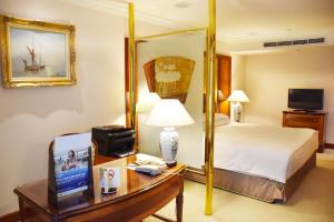 Voodi või voodid majutusasutuse Evergreen Laurel Hotel Taipei toas