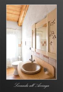 a bathroom with a sink and a toilet at Locanda Acciuga MM in Piazzola sul Brenta