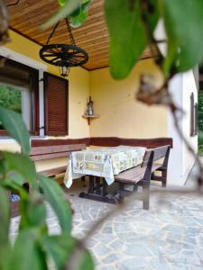 a table and a bench on a patio at Feriendomizil 219 in Allerheiligen bei Wildon
