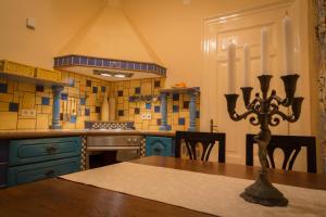 a kitchen with a table with a cross on the table at Apartment Bozic in Lovran