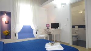 TV a/nebo společenská místnost v ubytování Antico Casale B&B