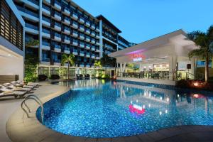 a large swimming pool in front of a hotel at Poolside Escape Near Boracay's Iconic Keyhole in Boracay