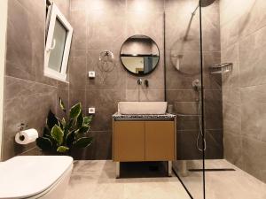 a bathroom with a shower and a sink and a mirror at Villa Maroula in Afantou +125 photos