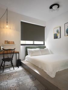 Vuode tai vuoteita majoituspaikassa 未艾公寓WeLove Apartment