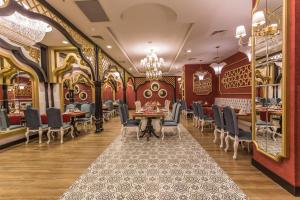 a restaurant with a dining room with tables and chairs at Mary Hotel Side in Side +6 photos