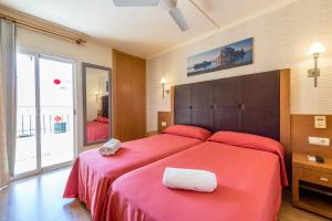 Cama o camas de una habitación en Hostal Residencia Europa Punico