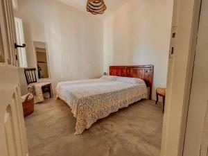 Un pat sau paturi într-o cameră la Borgo Ferraria +24 fotografii