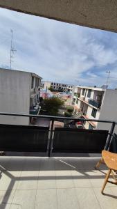 a balcony with a view of a building at Gioia in Augusta +1 photo