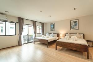 En eller flere senge i et værelse på Asok house Sukhumvit27 Free BF