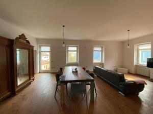 a living room with a table and a couch at Balina apartment in Tenno