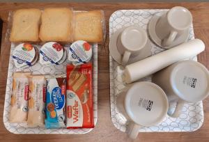 two plastic containers filled with breakfast food and bread at VICOLO in Civitavecchia