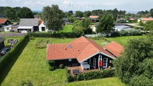 an aerial view of a house with an orange roof at Moderne sommerhus, 8 senge, 250 mtr til sandstrand in Slagelse